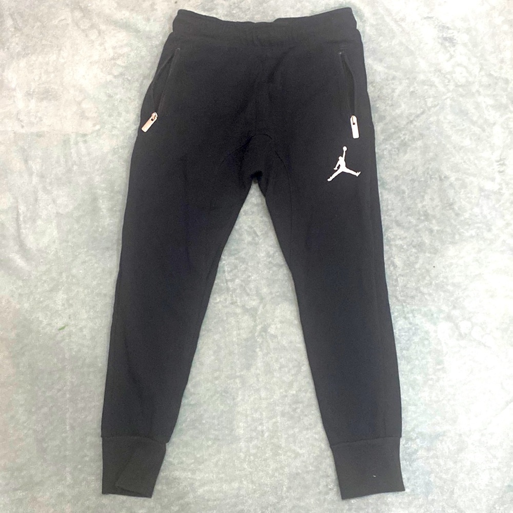 Nike Jordan black sweat pants size 10-12: 2 side zip up pockets, one back pocket